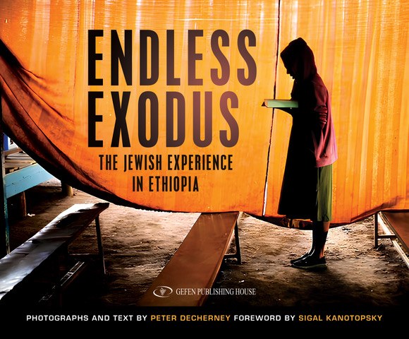 Cover of Peter Decherney, Endless Exodus: The Jewish Experience in Ethiopia (Gefen). A backlit silhouette in a vivid orange tent.