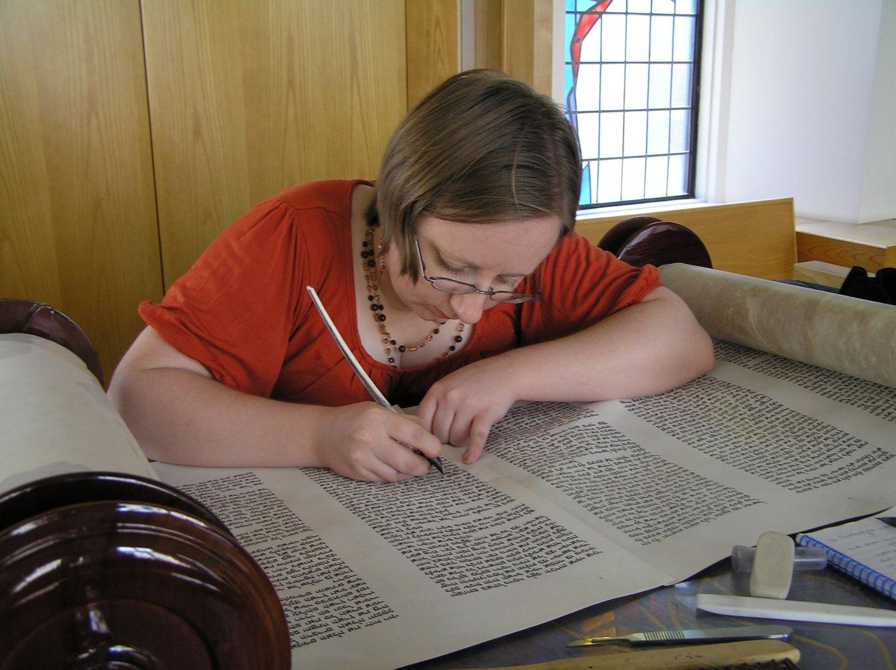 Jen Taylor Friedman, soferet, at work on a scroll.