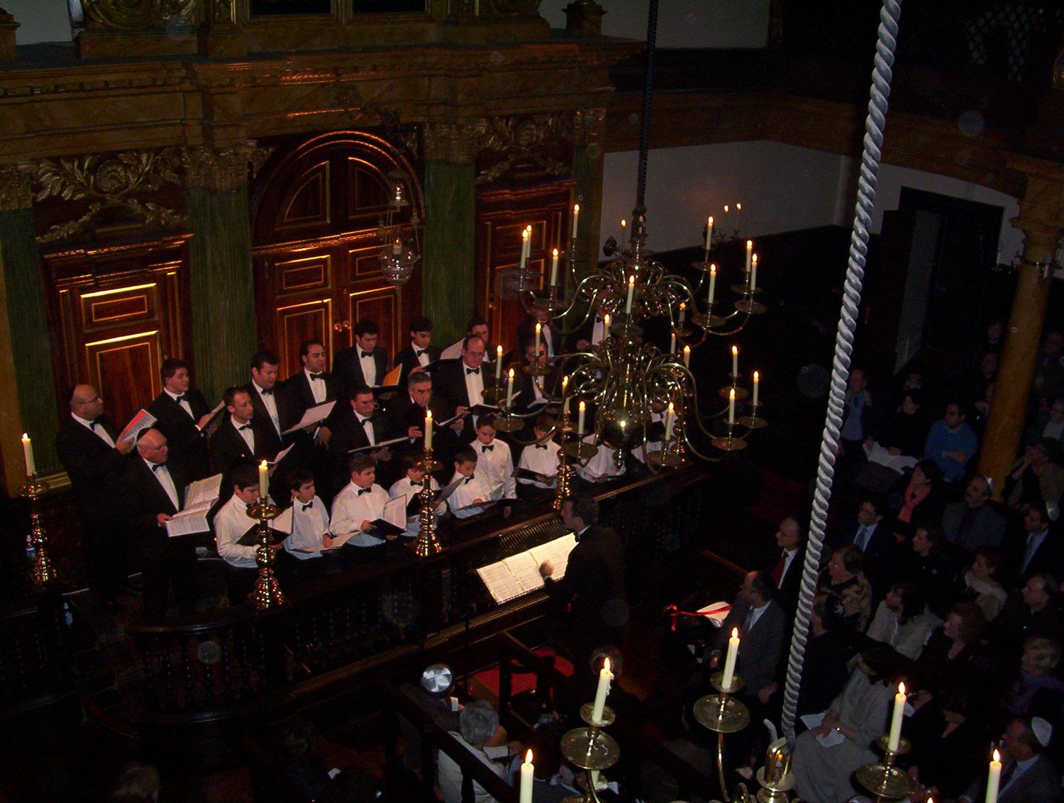 The choir of Bevis Marks Synagogue performing a candlelit concert.