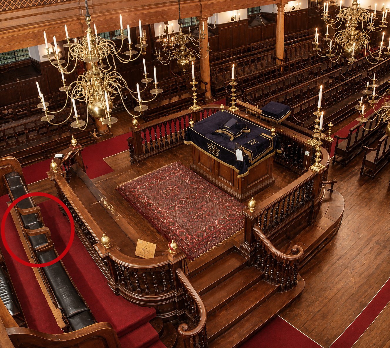 The bimah of Bevis Marks seen from above, marking the location of the choirmaster's seat.